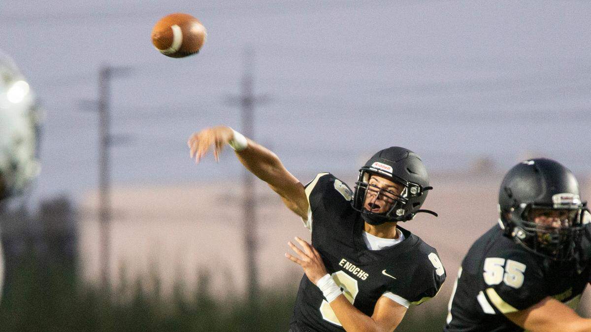 Keith Orona, 9, of Enochs High throws a pass upfield. Enochs High vs Buhach Colony football at Johansen Friday, Sept. 3, 2021.
