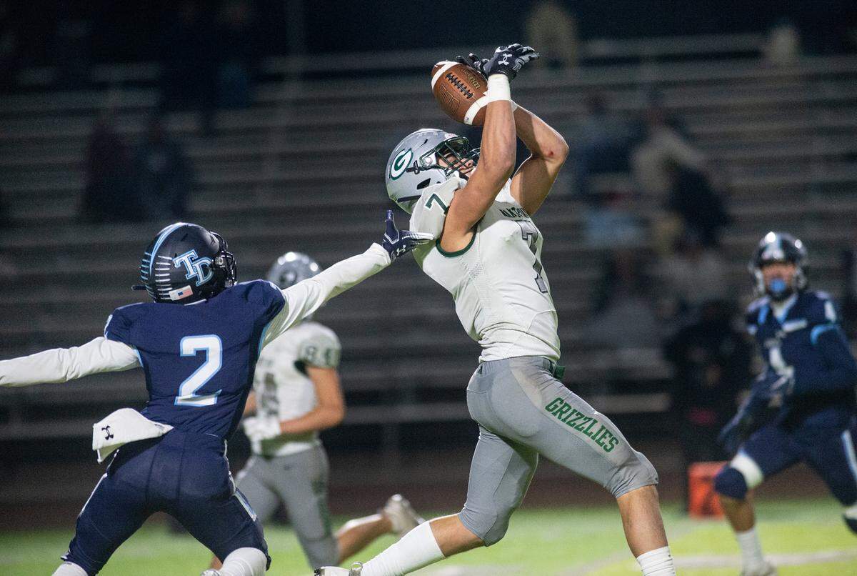 Granite Bay’s Frank Cusano reaches up for the ball but can’t come up with the ball as Downey’s Andres Tamayo defends during the CIF Sac-Joaquin Section Division II playoff game at Downey High School in Modesto, Calif., Friday, Nov.11, 2022.
