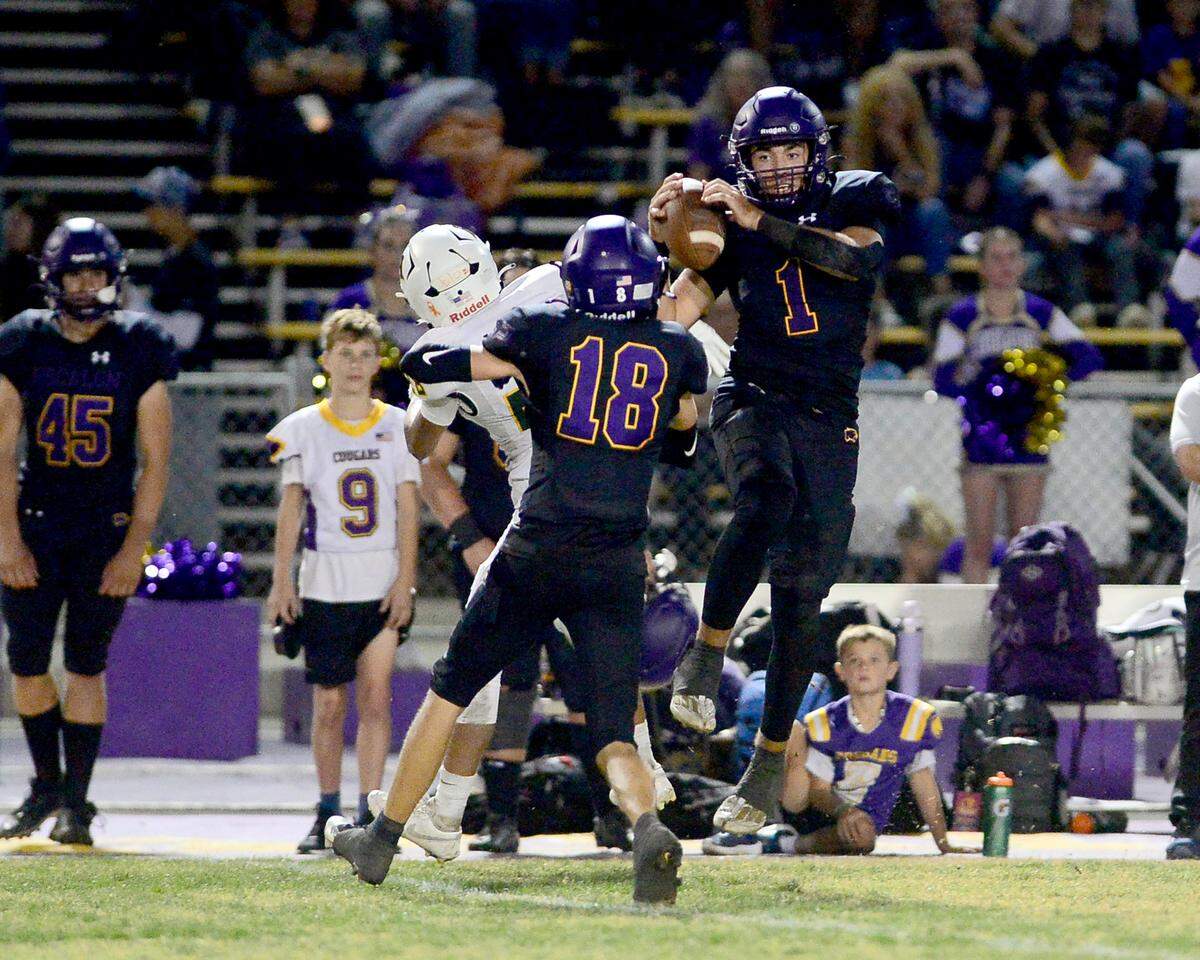Escalon’s Logan Huebner (1) leaps to make a deep catch during the game with Hilmar at Escalon High School  on  Sept. 26, 2025.