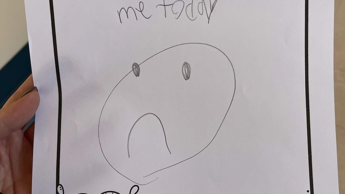 A first grader drew this picture of a frown while protesting, according to Superintendent Dave Kline.
