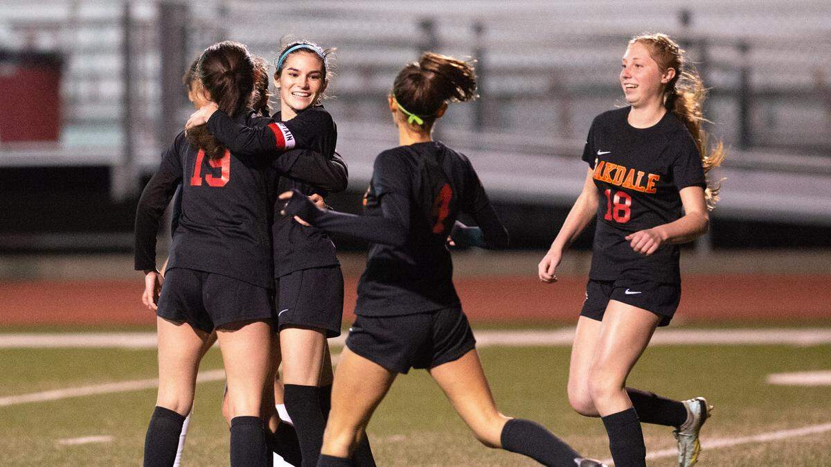 Oakdale’s Kyndra Obermeyer and her teammates celebrate after her goal during the Valley Oak League game with Kimball in Oakdale, Calif., Friday, Jan. 20, 2023. Oakdale won the game 2-1.