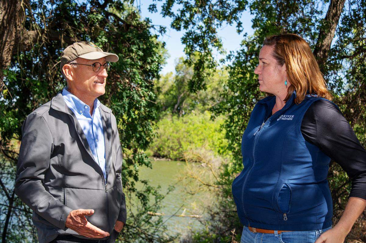 State Parks Director Armando Quintero talks about possibly adding part of Dos Rios Ranch to the system with River Partners President Julie Rentner. They met at the site southwest of Modesto CA on May 11, 2022.