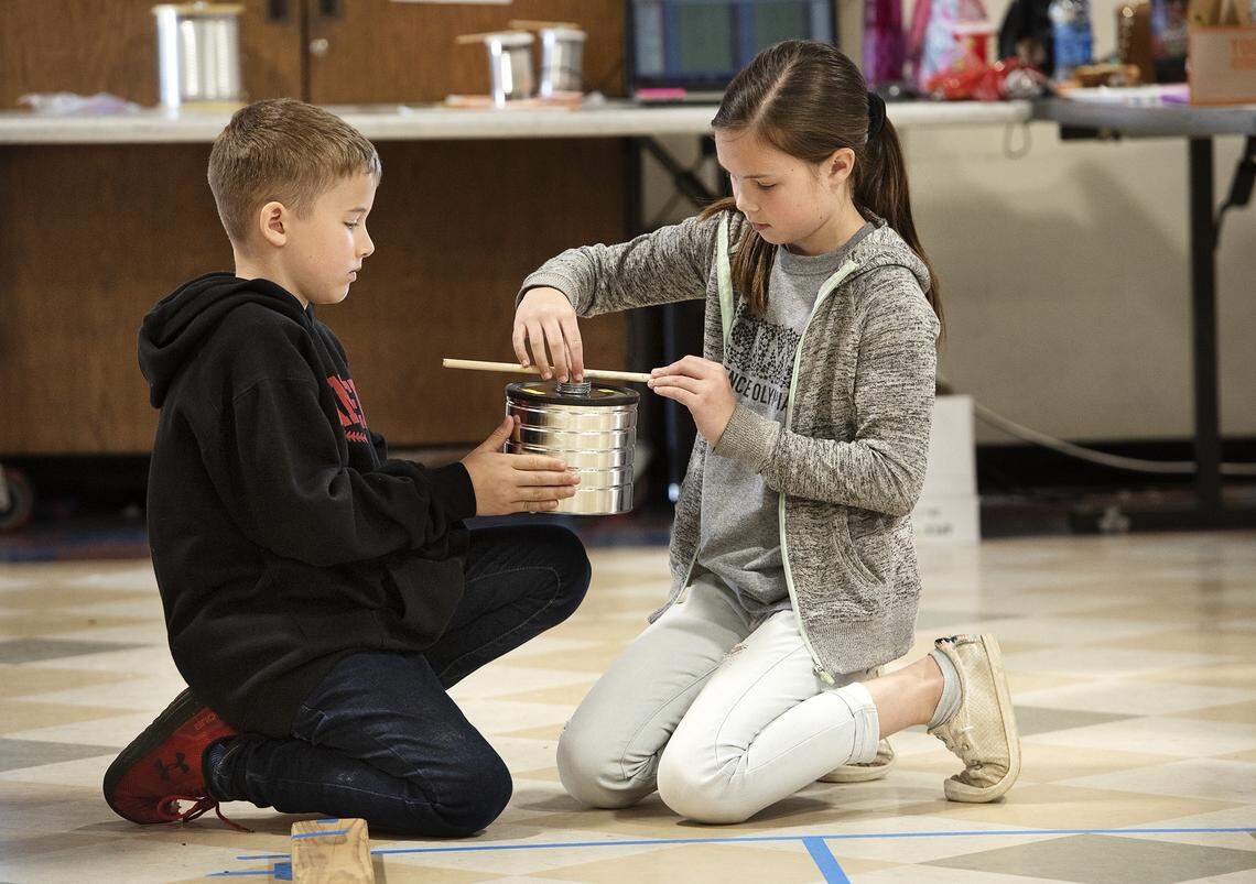 Brother and sister team from Hickman Charter, Maile and Dylan Poling, prepare their vehicle for the can race during the 22nd annual Stanislaus County Elementary Science Olympiad.