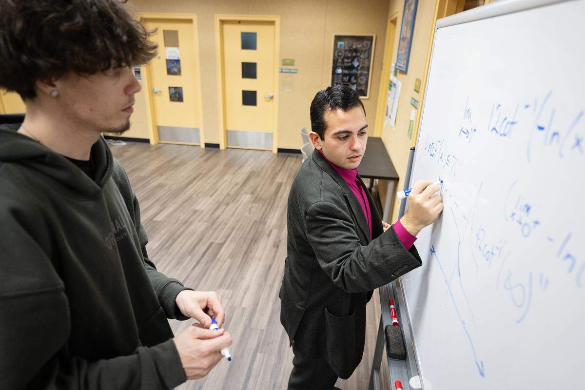 Mathematics professor Andrew Lazar tutors Noah Vandenburg in calculus at Modesto Junior College in Modesto, Calif., Wednesday, Feb. 7, 2024.