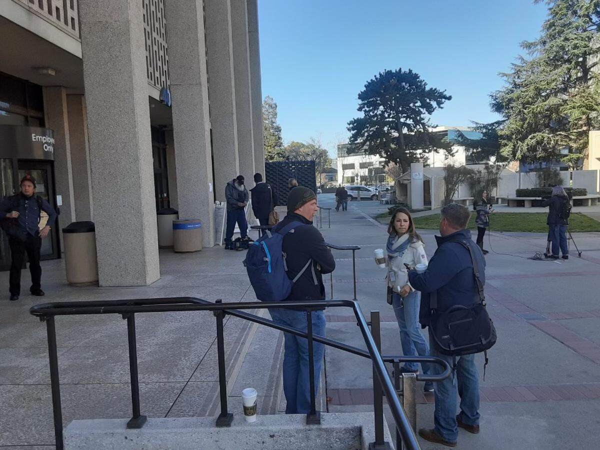 Members of the media gather outside the San Mateo County courthouse before a hearing for Scott Peterson Friday, Feb. 25, 2022.