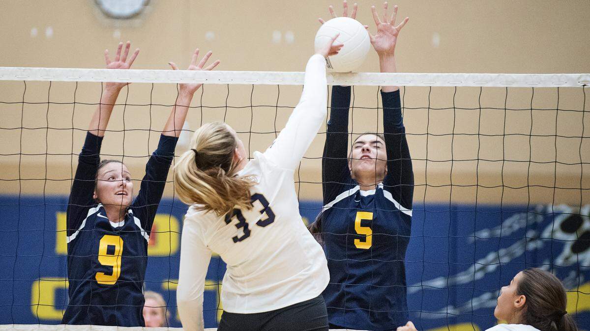 Gregori’s Bianca Dowlett (5) blocks Central Catholic’s Grace Mathias during Tuesday’s match in Salida, Calif., August 21, 2018. 