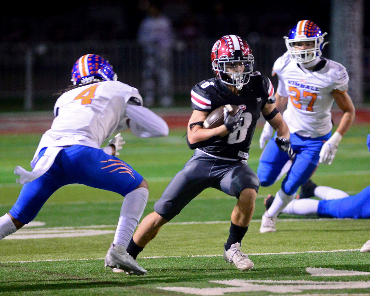 Patterson running back Coby Joseph (8) cuts up field during a Division IV Sac-Joaquin Section playoff game against Kimball in Patterson on Friday.