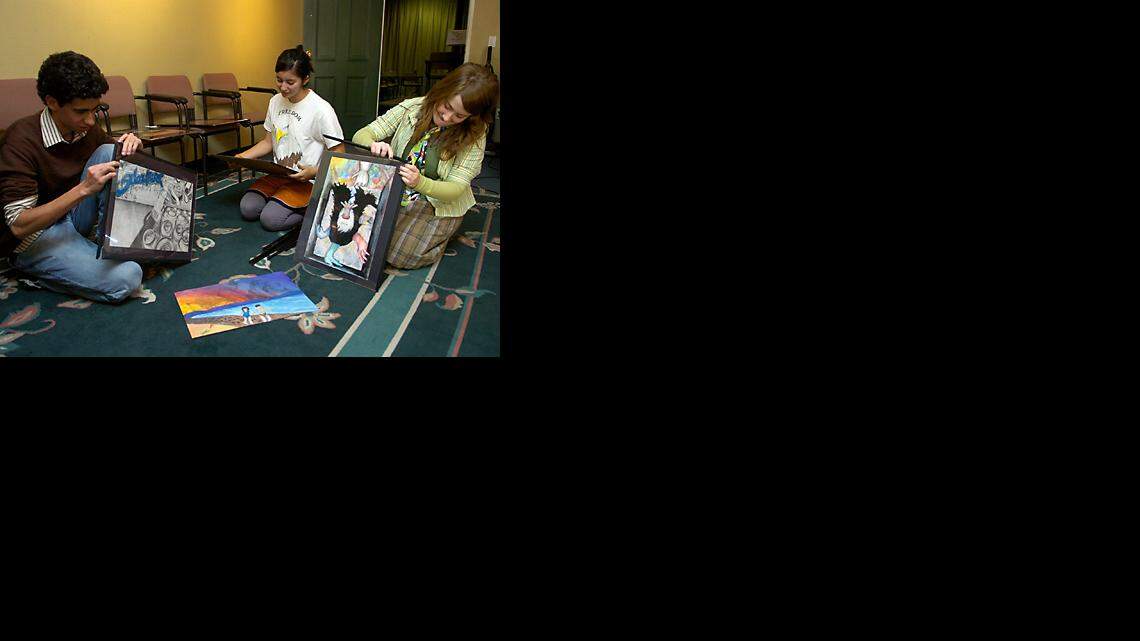 José Ramos, Alicia Valenzuela and Leslie Wyatt prepare their works Tuesday at Prospect Theater Project in Modesto.
(Bart Ah You/The Modesto Bee)