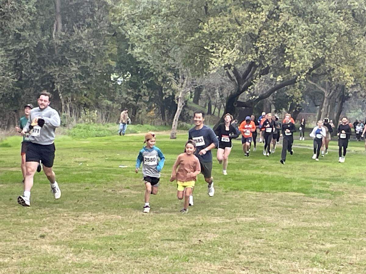 Runners do the 3.1-mile main event at the Turkey Trot on Nov. 27, 2025, in Modesto, Calif. It is held in Tuolumne River Regional Park and raises money for the Modesto Junior College track and cross country teams.
