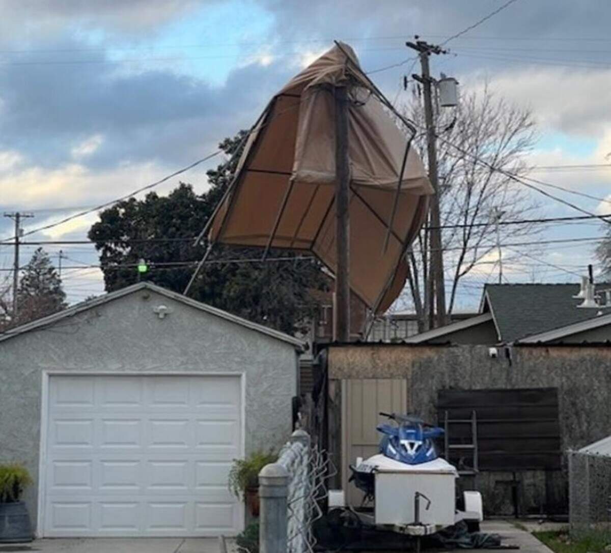 Wind gusts blew up to 55 mph in Modesto Sunday, falling trees, communication lines and unsecured objects.