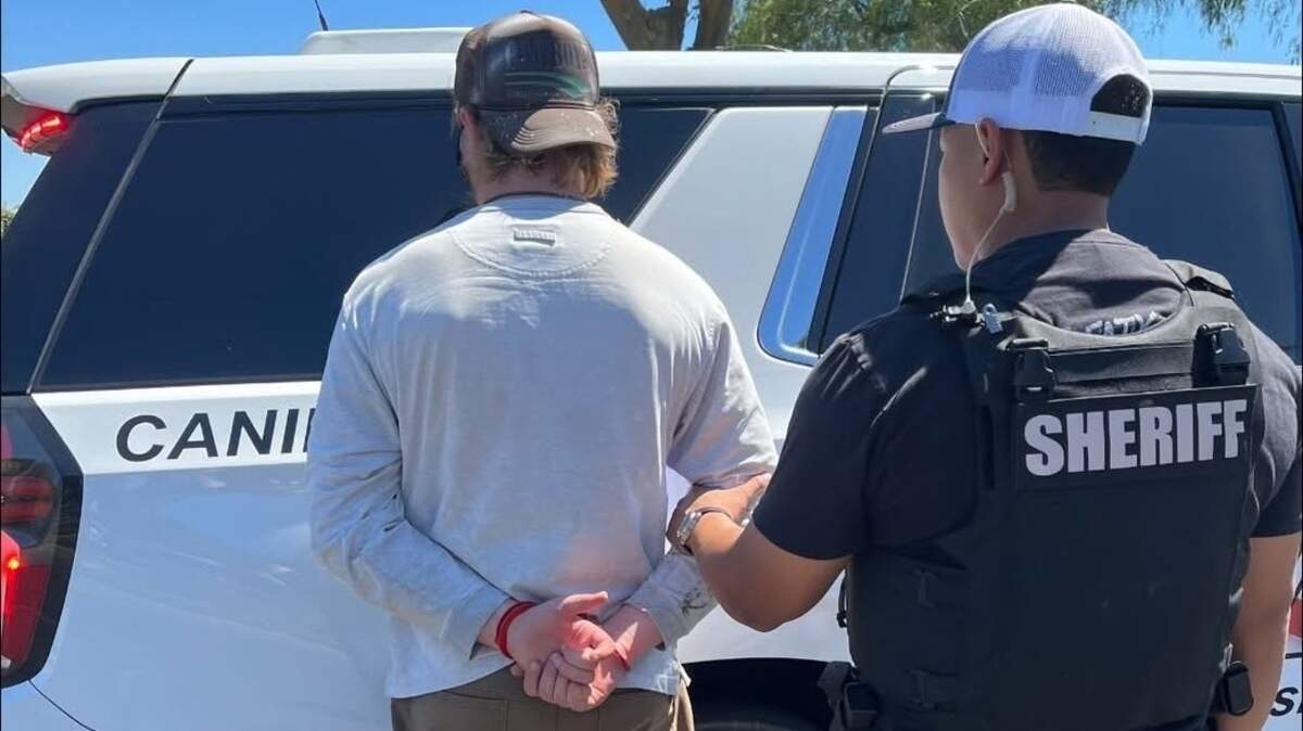 Phillip Abraham Daniel Capeder, 32, of Oakdale, is taken into custody by a Patterson Police Services detective following an investigation into allegations that he arranged to meet a person he believed was a minor for the purpose of engaging in sexual activity.