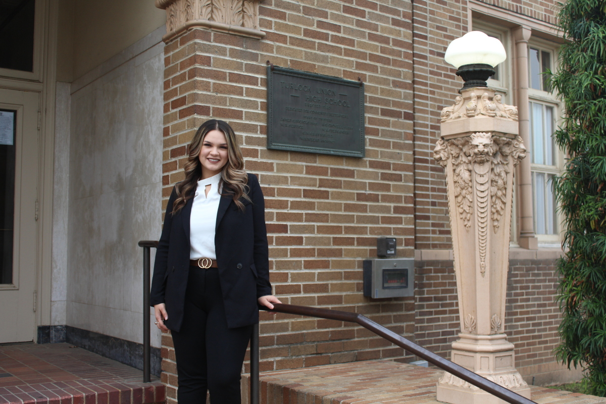 Angélica Cárdenas Ayala stands outside Turlock Unified School District’s office building on Nov. 22. Ayala, a Turlock High School alumna, was recently hired as Coordinator of Equity Initiatives.