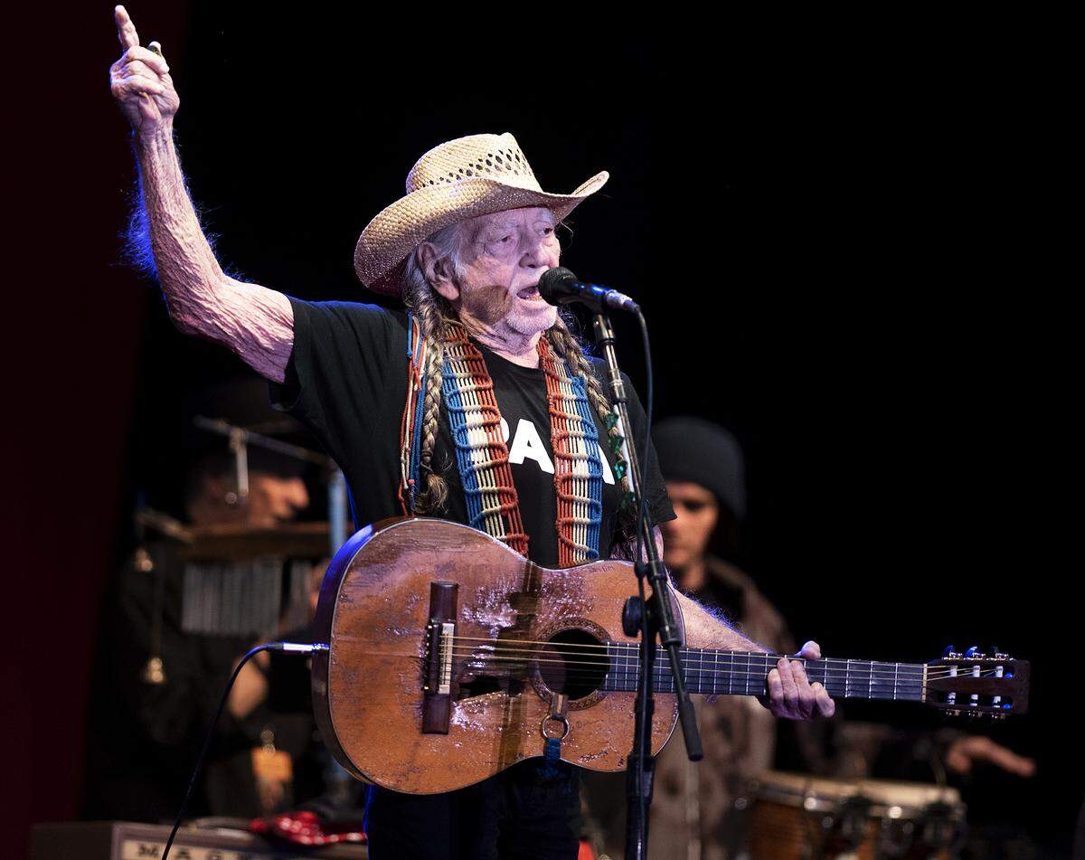 Country singer Willie Nelson, shown performing in Modesto, Calif., in 2019, spearheads the Outlaw Music Festival each year.