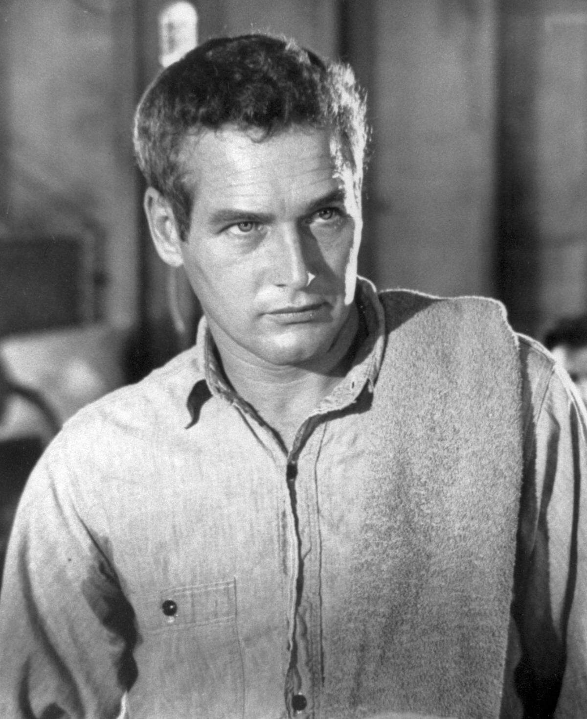 ** FILE **In this 1968 file photo released by Warner Bros., actor Paul Newman played a prisoner who becomes a legend to his fellow members of a chain gang in the film ‘’Cool Hand Luke.” Newman, the Academy-Award winning superstar who personified cool as an activist, race car driver, popcorn impresario and the anti-hero of such films as “Hud,” “Cool Hand Luke” and “The Color of Money,” has died, a spokeswoman said Saturday. He was 83. Newman died Friday, Sept. 26, 2008, of cancer, spokeswoman Marni Tomljanovic said. (AP Photo/Warner Bros., File)