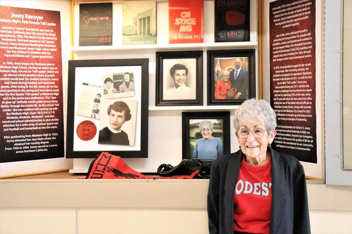 Modesto City Councilwoman and Modesto High School alum Jenny Kenoyer stands in front of the display case celebrating her time at the campus and becoming the school’s first female “Yell Leader” in the early 1960s.