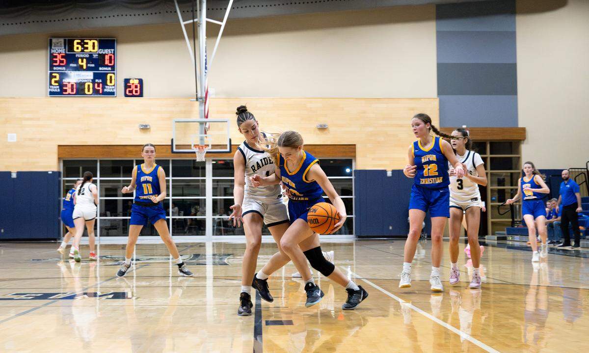 Ripon Christian’s Rhian Heuvel is challenged by Central Catholic’s Ayla Parcon during the MST Gallo Tournament at Central Catholic High School in Modesto, Monday, Dec. 29, 2025.