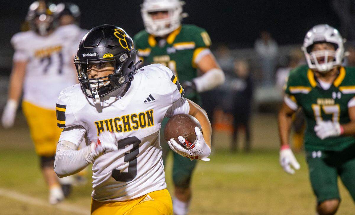 Lawson Aviles, 3, of Hughson High looks up field for an opening during the Trans-Valley League game against Hilmar in Hilmar, Calif. on Friday Oct. 25, 2024.
