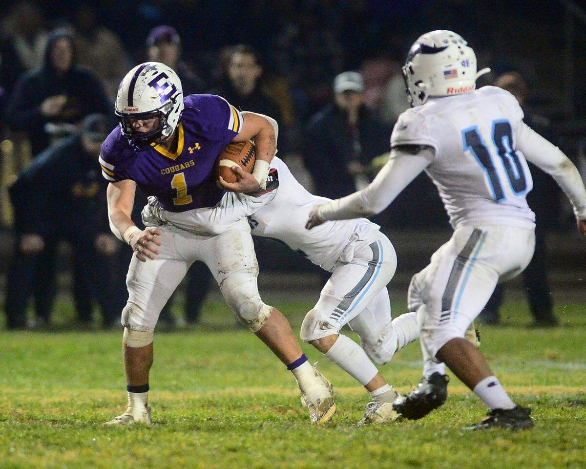 Escalon running back Ryker Peters (1) runs through an arm tackle during the 2022 CIF NorCal Division 4-AA Bowl Game between Escalon High School and Pleasant Valley High School at Escalon High School in Escalon CA on Dec. 2, 2022. Escalon won the game 42-20.
