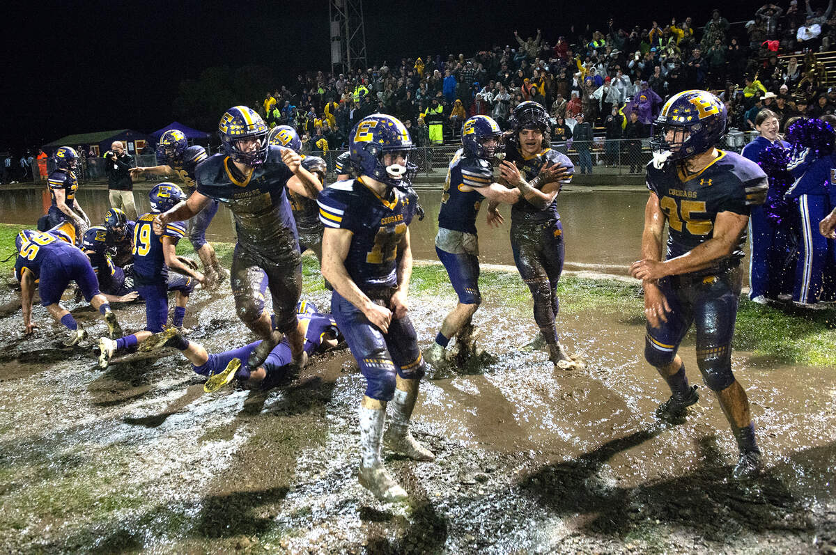 Escalon players celebrate their 28-7 victory over Northwood High School in the CIF State Division 4-AA Football Championship game in Escalon, Calif., Saturday, Dec. 10, 2022.