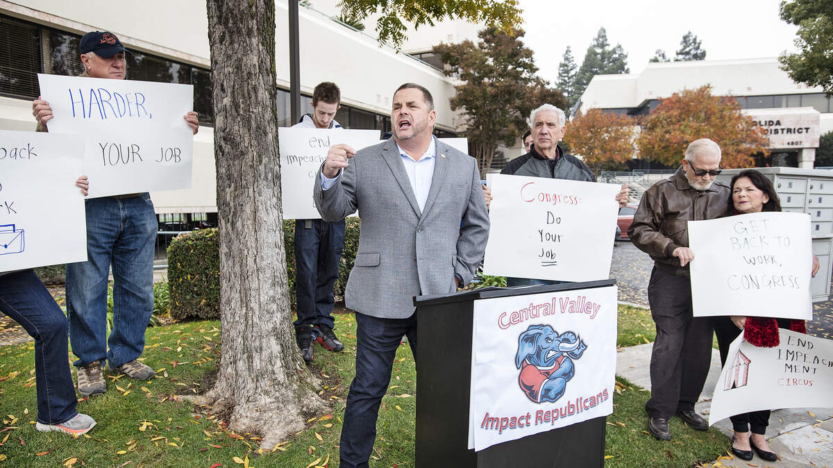 Ted Howze, a Republican candidate in the 10th Congressional District, speaks outside Congressman Josh Harder’s district office in Salida, Calif., Thursday, Dec. 5, 2019. The Central Valley Impact Republicans invited Howze to speak during a rally to protest congressional impeachment hearings.
