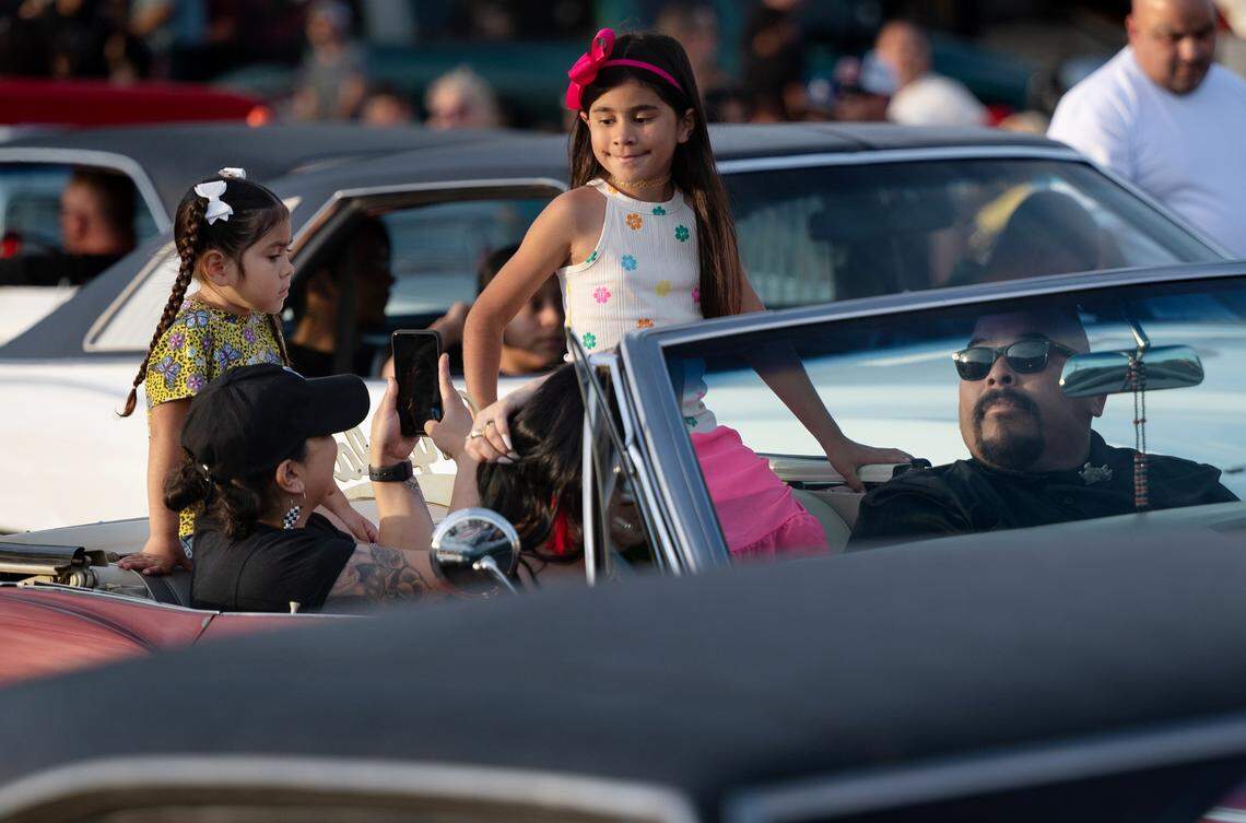 Classic car owners cruise down McHenry Avenue during the Graffiti Parade in Modesto, Calif., Friday, June 9, 2023.