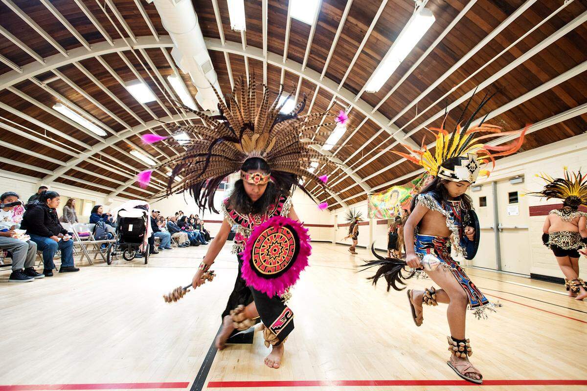 Members of Ballet Folklorico Anahuac Dahlia Leon, 12, left, and Felix Martinez, 10, right, perform during Cesar Chavez Family Day Celebration at Chavez Park in Modesto, Calif., on Saturday, April 7, 2018.