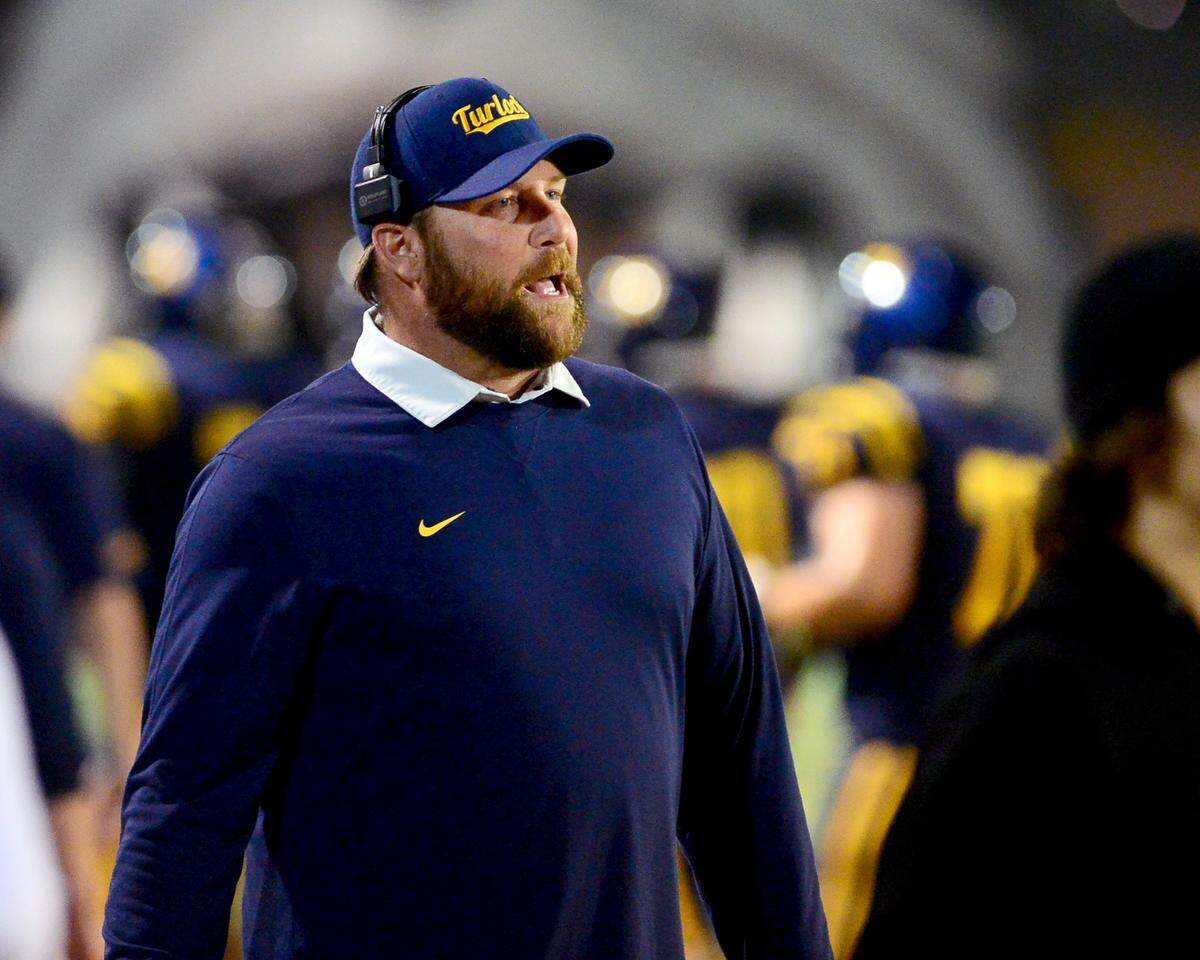 Turlock Head Coach James Peterson disputes a call during a CIF Sac-Joaquin Section Football Division I playoff game between Turlock high School and Sheldon High School at Turlock High School in Turlock, California on Nov. 3, 2023.