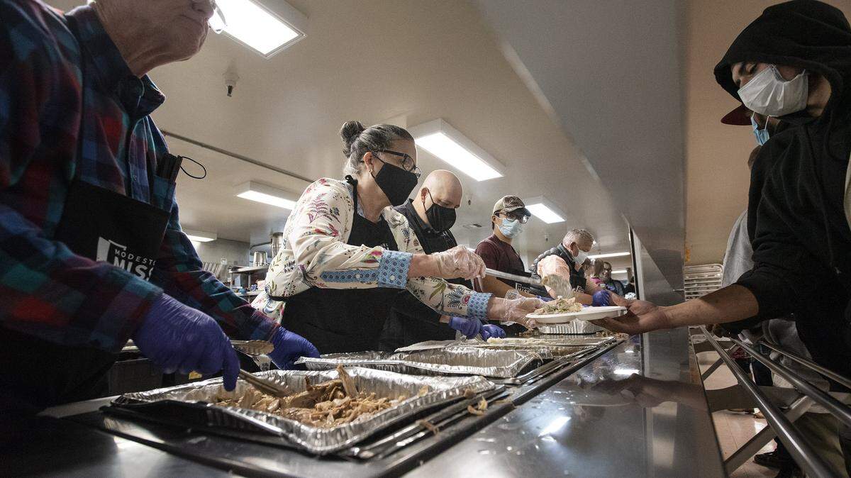 Volunteers serve a Thanksgiving meal in a past year at the Modesto Gospel Mission.