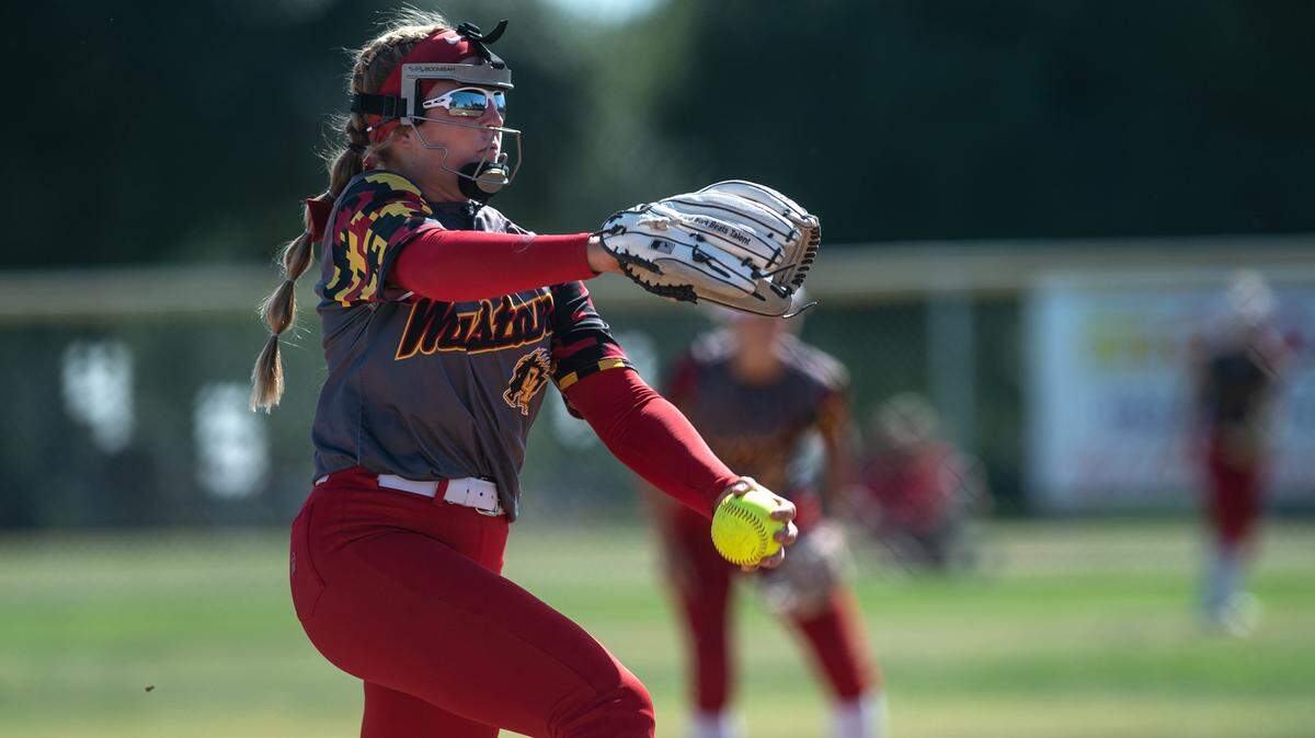 Oakdale’s Delainey Everett winds up for a pitch during the first round playoff game with Beyer at Oakdale High School in Oakdale, Calif., on Tuesday, May 17, 2022.