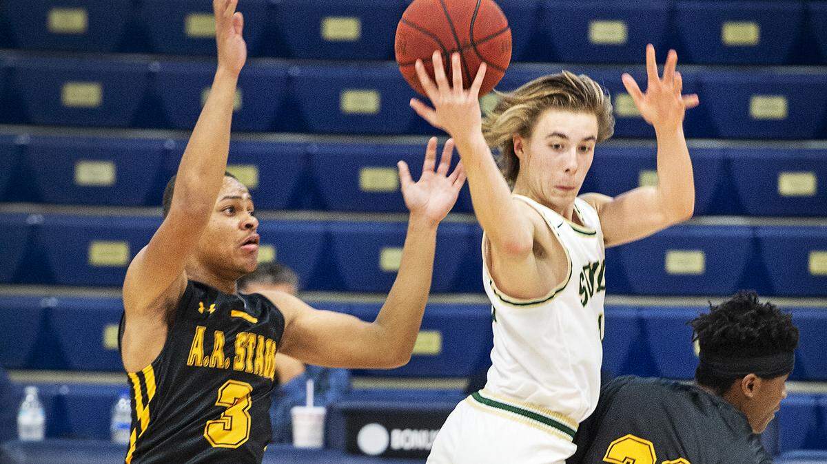 Sonora’s Callahan Hanson grabs a loose ball between Stagg’s Kamar Fields (20) and Jason Shannon-Phillips (3) during the Mark Gallo Invitational basketball tournament at Central Catholic High School in Modesto, Calif., Tuesday, Dec. 10, 2019. Sonora won the game 72-46.
