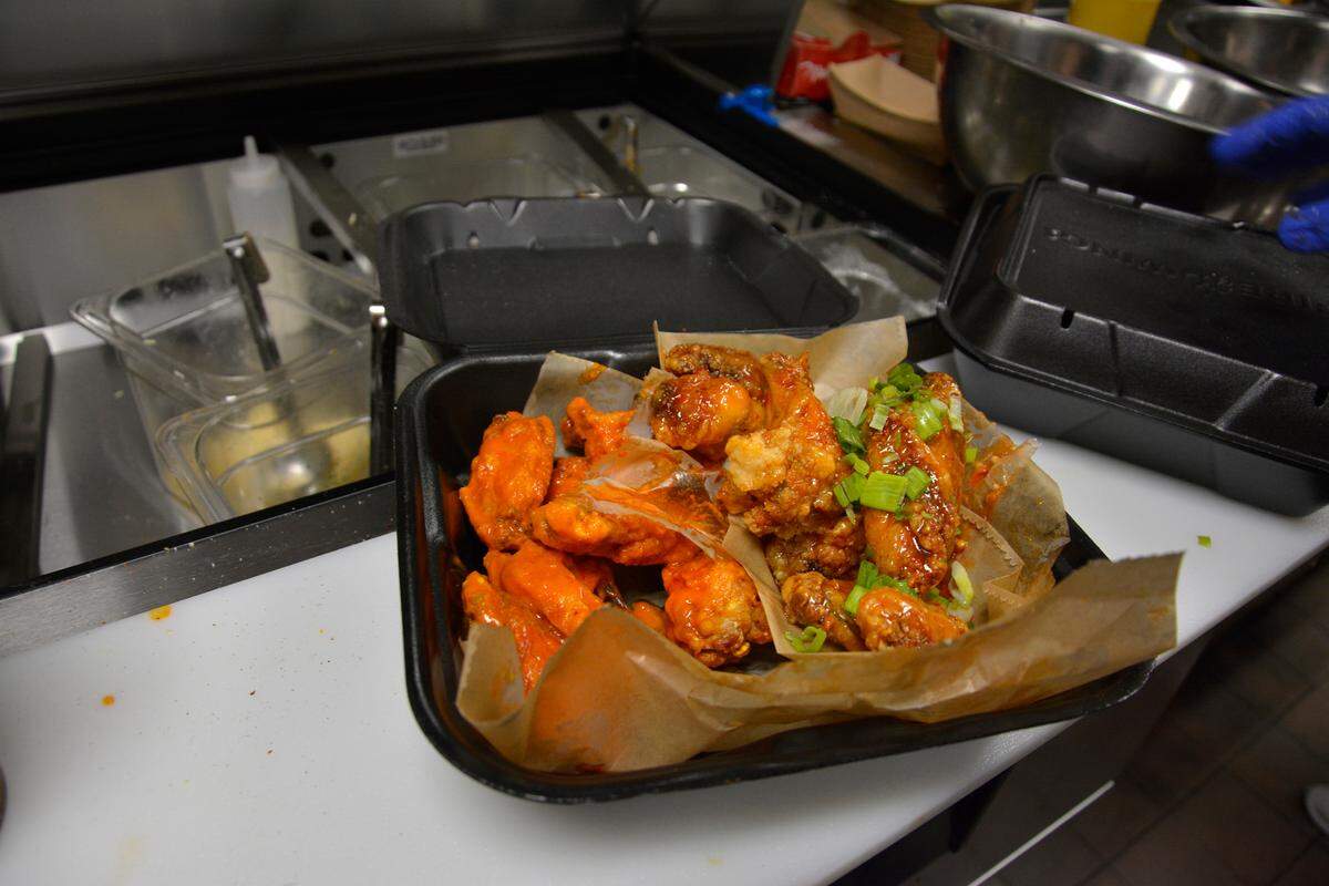 An order of wings being prepared at the new Fire Wings restaurant in Modesto, Calif.