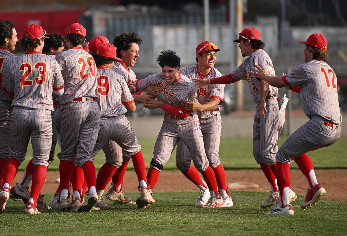 Oakdale players celebrate a 2-1 walk-off win over Patterson in the Valley Oak League game at Oakdale High School in Oakdale, Monday, April 7, 2025.