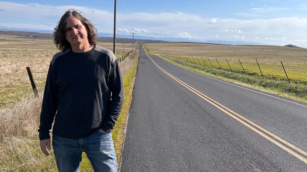 Ty Phillips standing on Warnerville Road, right outside Oakdale.
