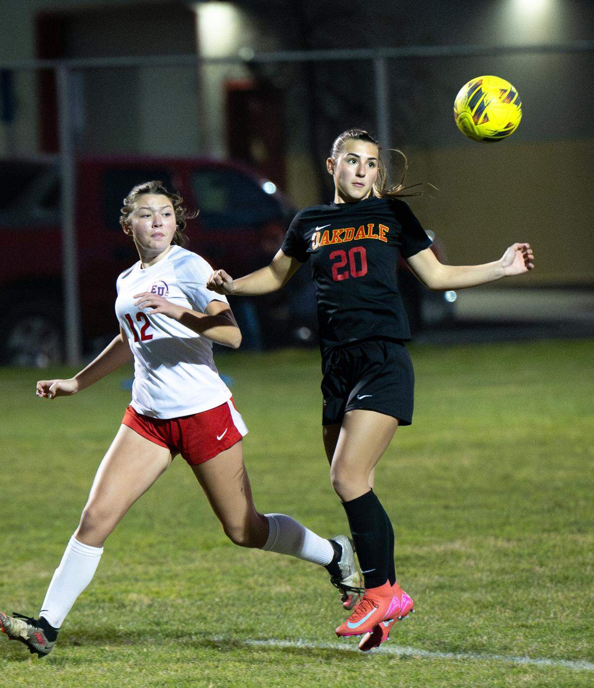 Oakdale’s Ashlyn Splettstoesser fields a pass as East Union’s Carerra Mendez defends during the Valley Oak League game in Oakdale, Friday, Jan. 17, 2025.