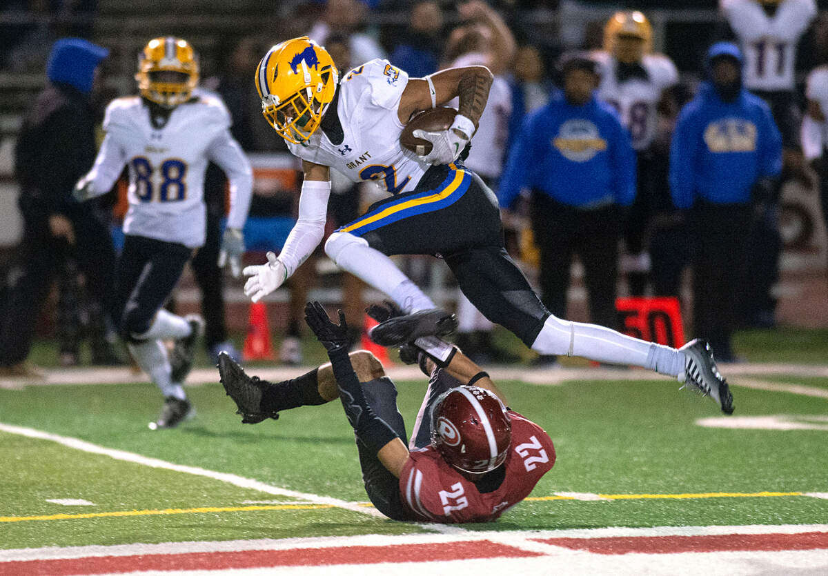Grant’s Kingston Lopa (2) intercepts a ball intended for Patterson’s Austin Lucas during the Sac-Joaquin Section Division III semifinal playoff game in Patterson on Friday. Grant won 80-44.