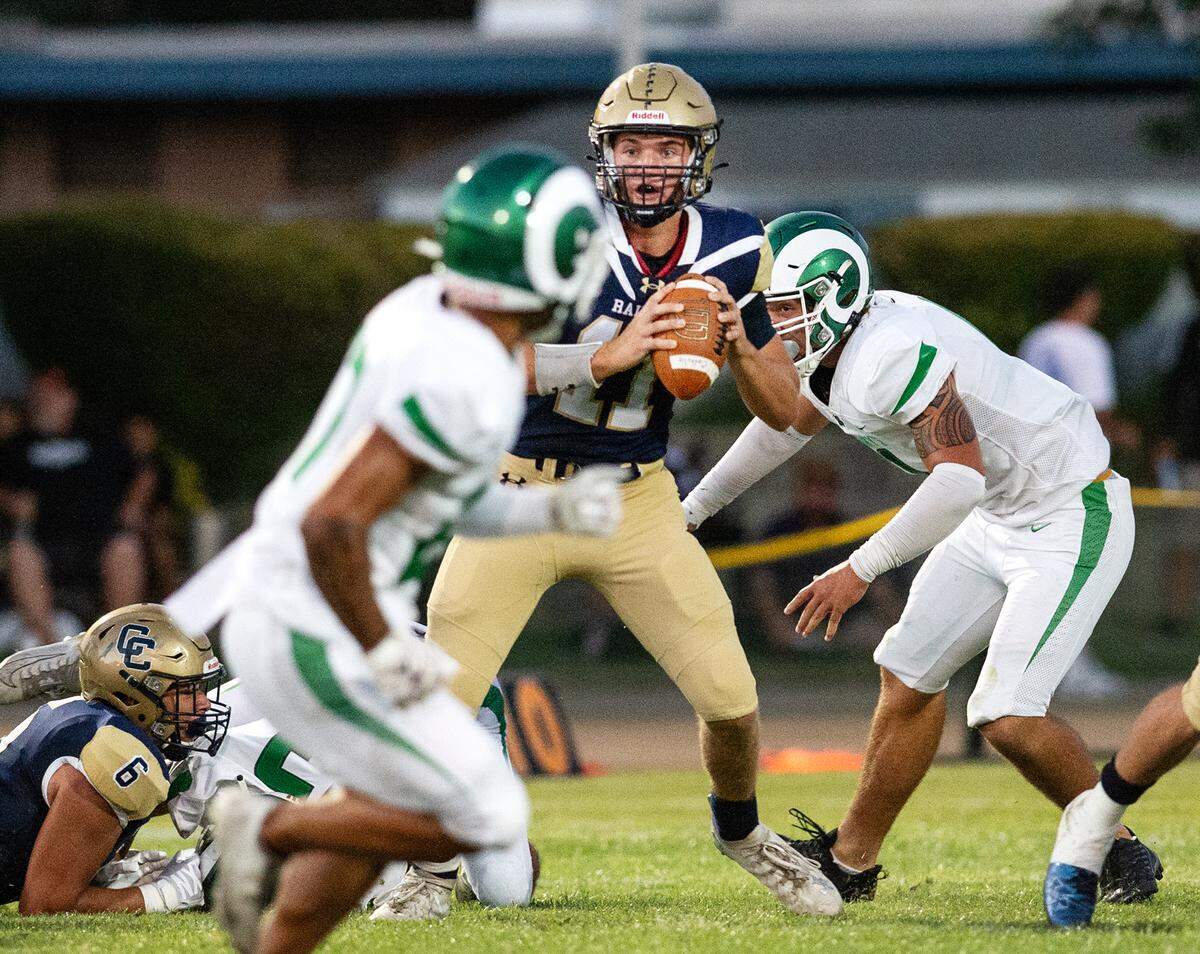 Under pressure from St. Mary’s defense, Central Catholic quarterback Tyler Wentworth looks for an open receiver during the non-league game at Central Catholic High School in Modesto, Calif., on Friday, September 2, 2022.