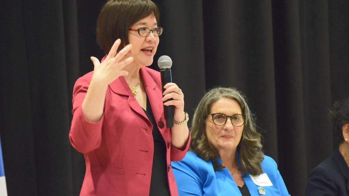Chiing Tong, president and CEO of National ACE, speaks at an April 25, 2022 roundtable event in Modesto where Modesto Mayor Sue Zwahlen sits in the background.