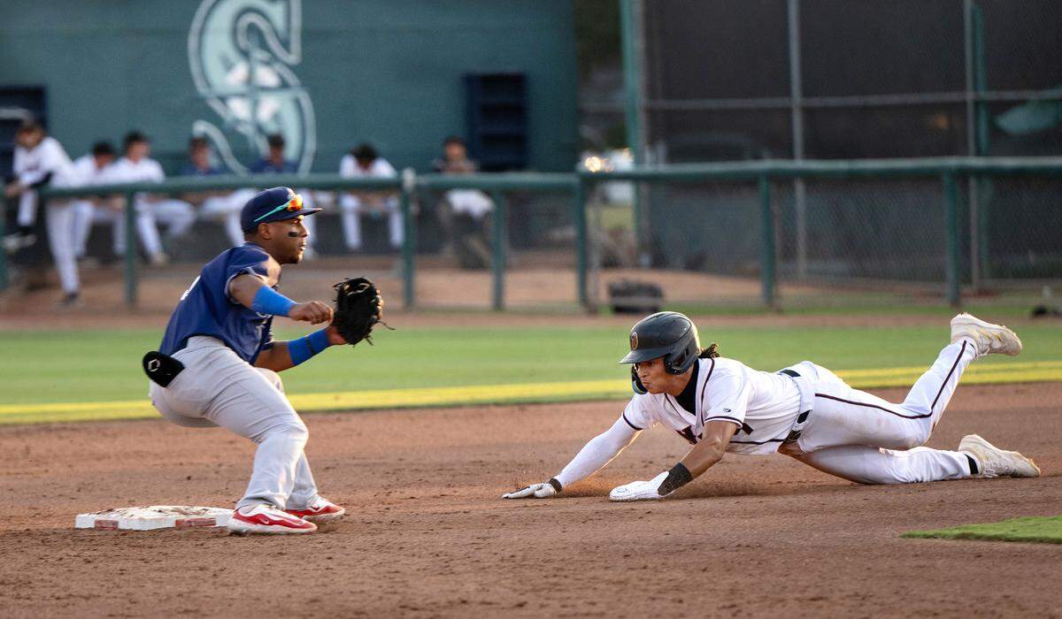Modesto Nuts’ Tai Peete steals second base during the game with the Stockton Ports at John Thurman Field in Modesto, Calif., Friday, July 19, 2024.