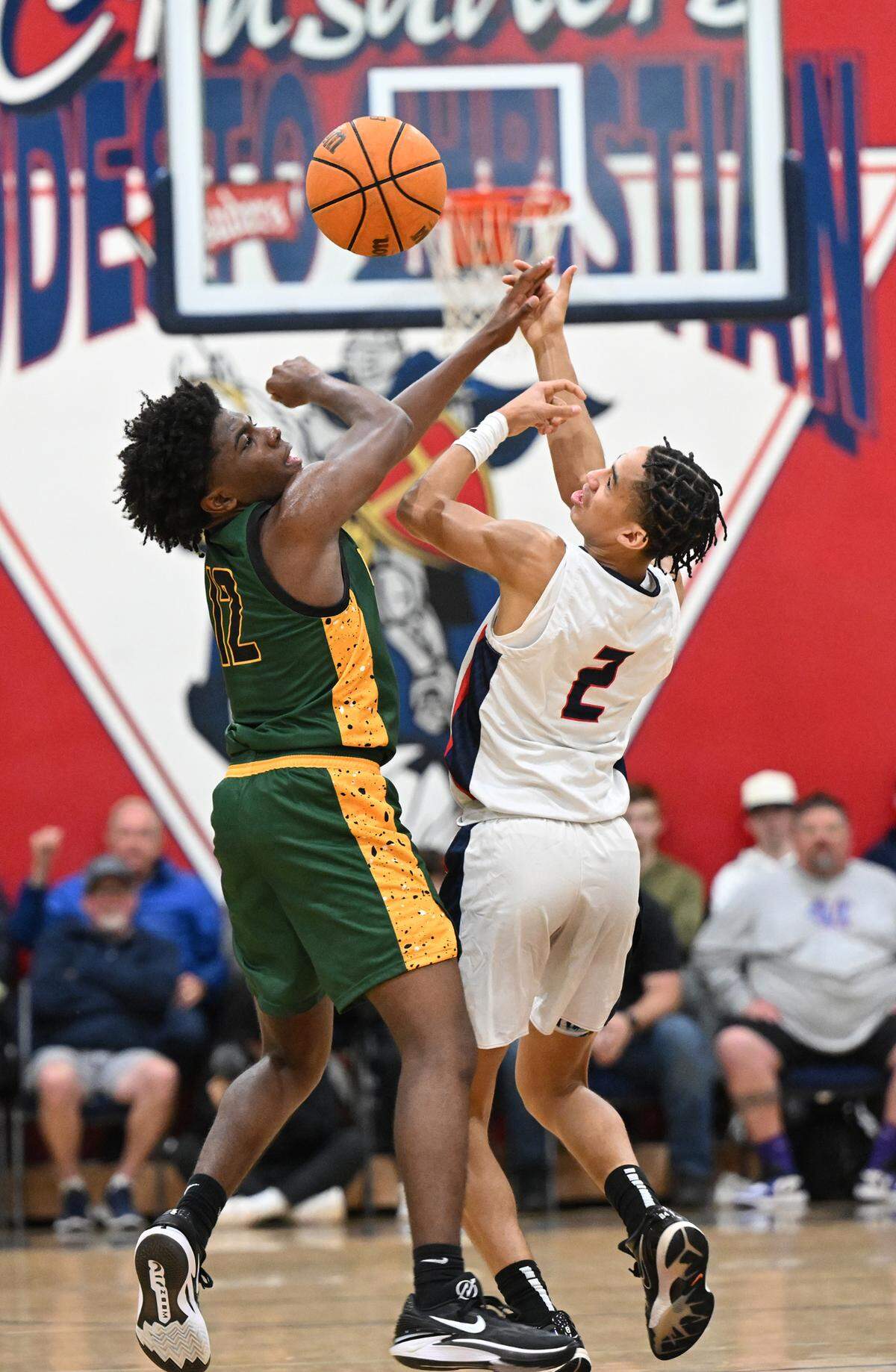 Modesto Christian’s Rashod Cotton and Vanden’s AnDrue Perkins battle for a loose ball during the Holiday Hoop Classic championship game at Modesto Christian High School in Salida, Calif., Saturday, Dec. 30, 2023. Modesto Christian won 68-61.