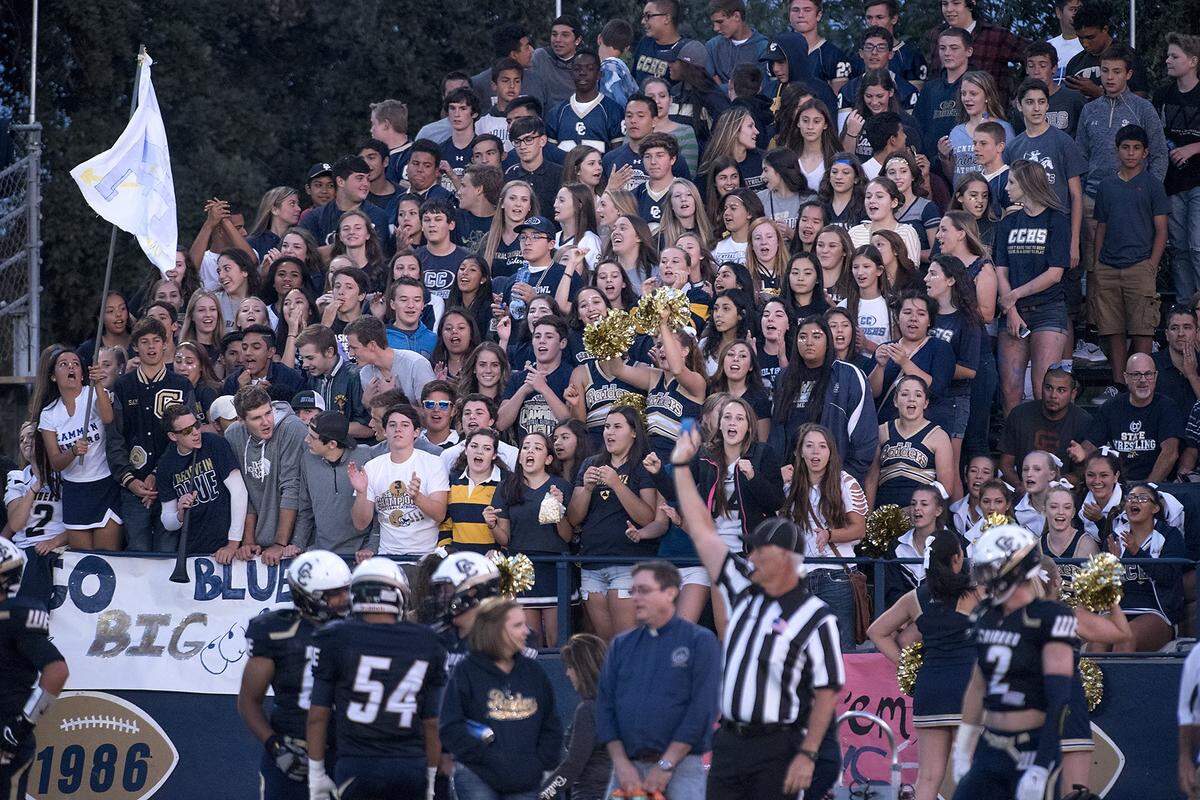 Central Catholic students cheer on their team during a nonconference game with Atwater in Modesto, Calif., on Friday, Sept. 4, 2015. Central Catholic won the game 49-0.