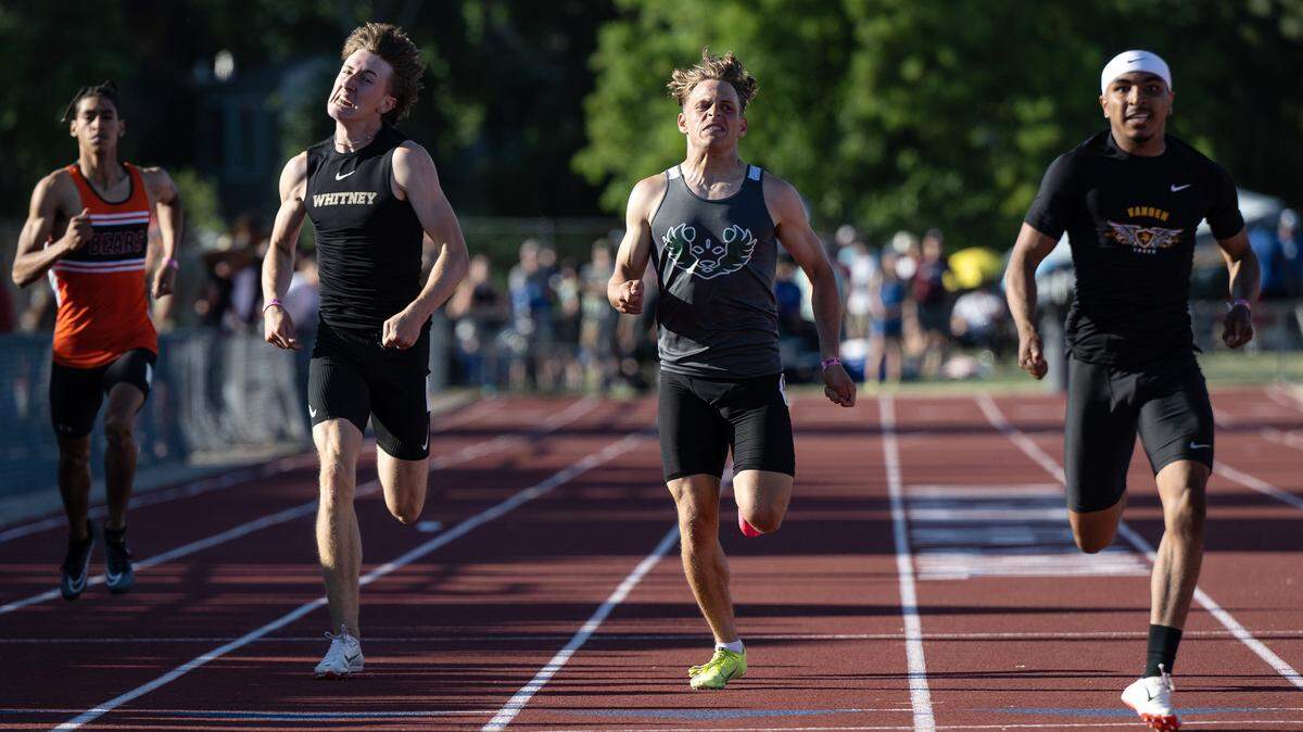Pitman’s Joey Stout, middle, tries to catch Varden’s Brayden Chavez, right, and edges out Whitney’s John Dailey, second left, for second place in the 400 meter race at the CIF Sac-Joaquin Section Masters track finals at Davis High School in Davis, Calif., Saturday, May 20, 2023. Stout finished with a time of 48.27.