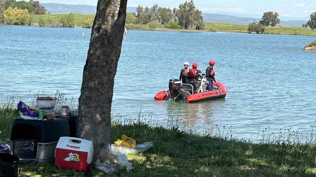 The Stanislaus County Sheriff’s Office searches for a missing swimmer at Woodward Reservoir’s Mountain View Point on Sunday, April 22, 2024.
