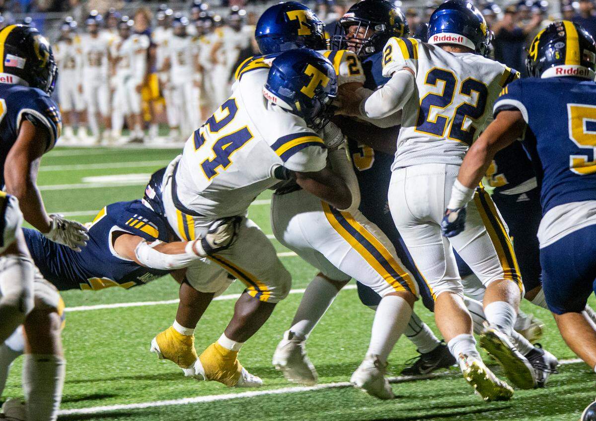 Tarell Johnson, 24, of Turlock High falls into the end zone during the first half of play against Gregori High Thursday Sept. 28, 2023 night.