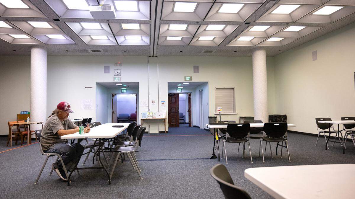 The Stanislaus County Library has an after hours cooling center at its branch in Modesto, Calif., Wednesday, July 10, 2024. Jon Yandell spends some time in the library cooling off.