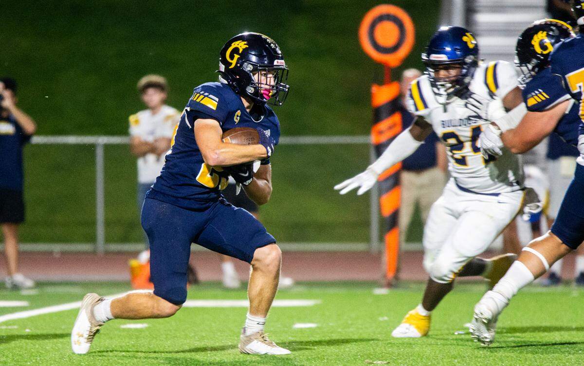 Michael Marsden, 23 of Gregori works his way upfield with Tarell Johnson, 24, of Turlock High working his way over Thursday Sept. 28, 2023.