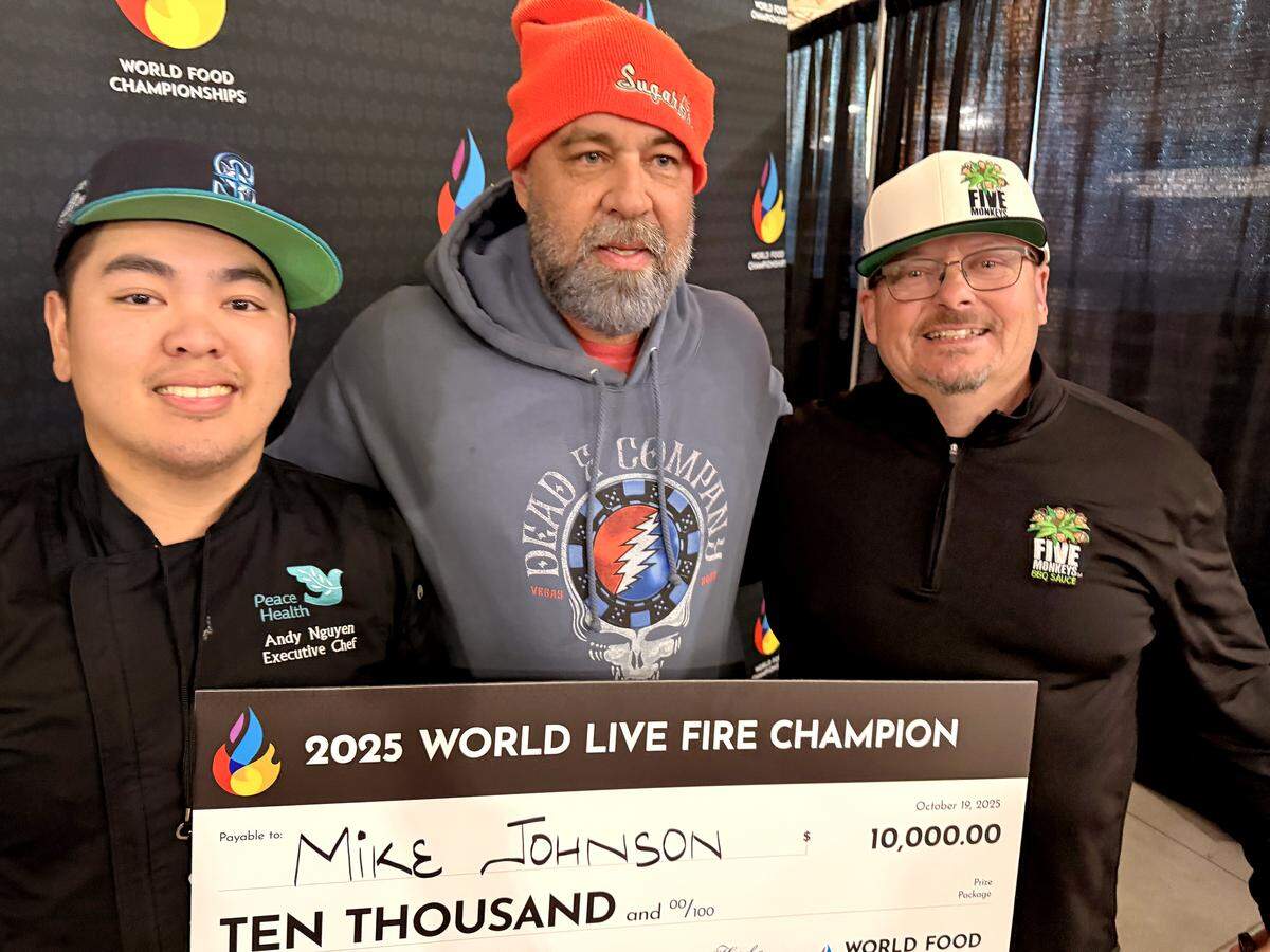 From left to right, Andy Nguyen, Mike Johnson and George Morasci won first place as a team in the live fire category of the World Food Championships in Indianapolis on Sunday, Oct. 19, 2025.