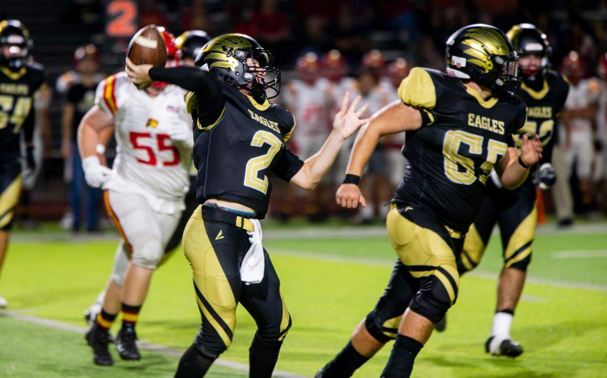 Quarterback Johnny Staggs, 2, throws a pass upfield during the Oakdale vs Enochs game Friday Sept. 22, 2023