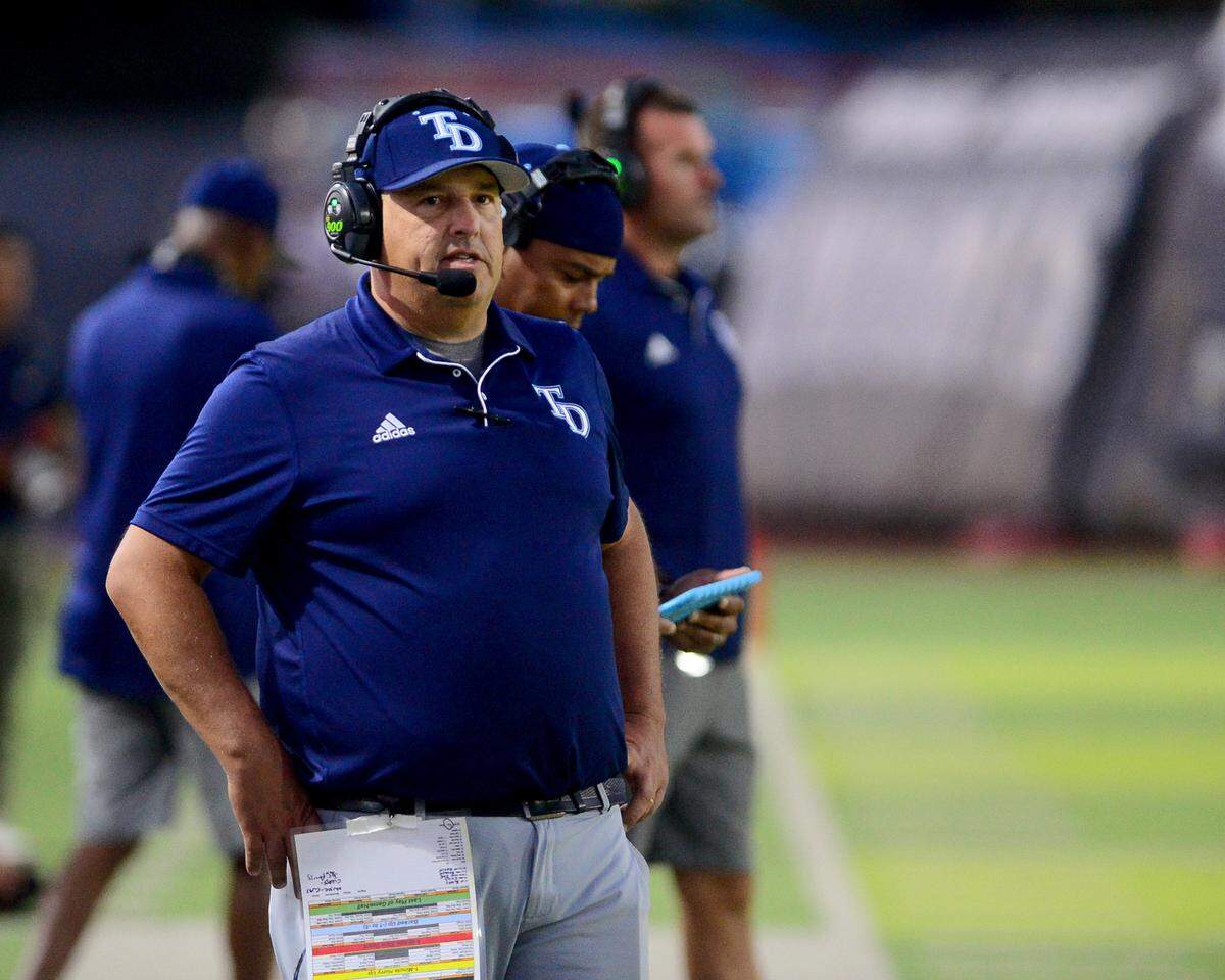 Downey head coach Jeremy Plaa looks toward the field during a game between Downey High School and Elk Grove High School at Downey High School in Modesto, Calif. on August 30, 2024.
