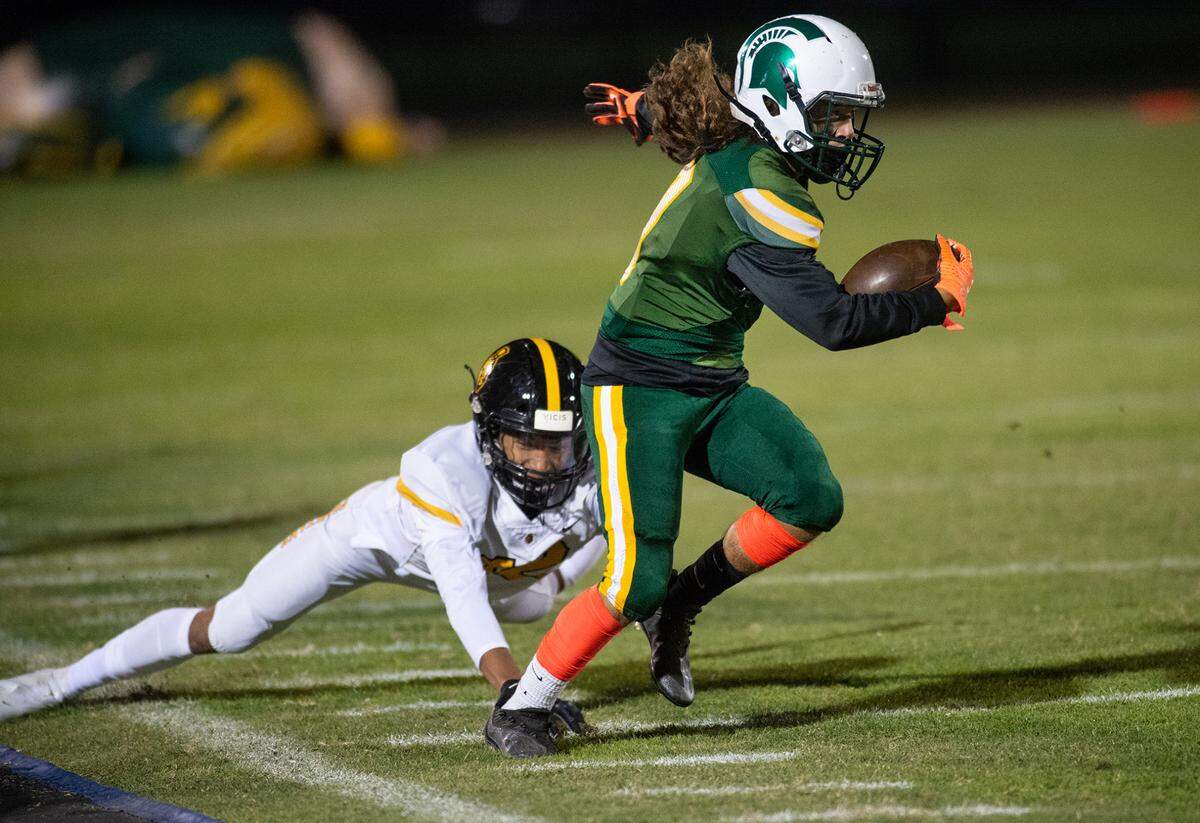 Davis’ Jordan Mendoza runs after a catch during the Western Athletic Conference game with Lathrop at Modesto Junior College in Modesto, Calif., on Friday, Oct. 8, 2021. Davis won the game 25-13.