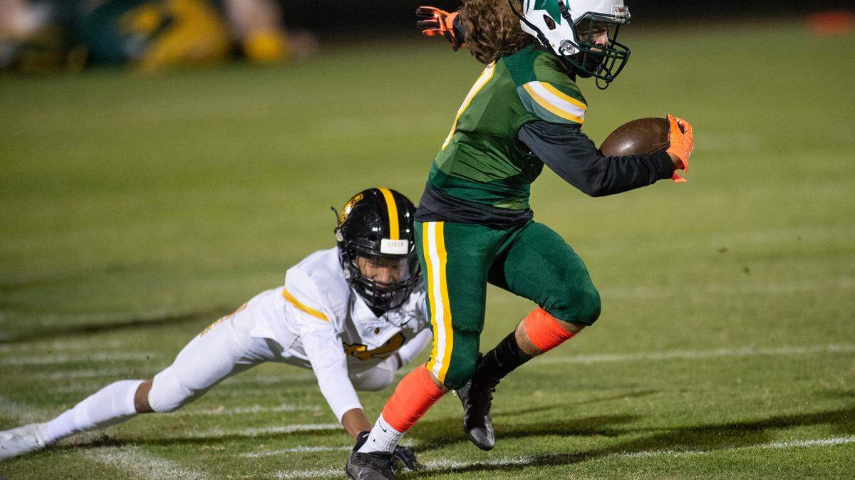 Davis’ Jordan Mendoza runs after a catch during the Western Athletic Conference game with Lathrop at Modesto Junior College in Modesto, Calif., on Friday, Oct. 8, 2021. Davis won the game 25-13.